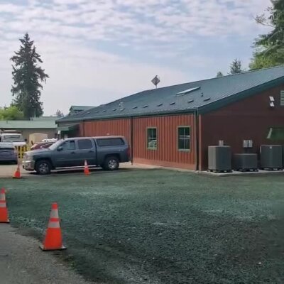 Newly applied erosion control hydroseed on commercial animal shelter grounds.