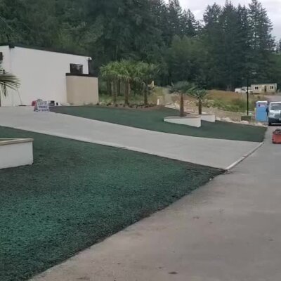 Freshly installed hydroseed lawn on a high-end new construction front yard in Washington.