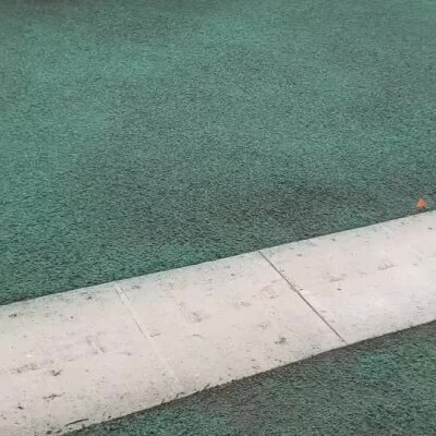 Fresh hydroseed applied on lawn near sidewalk in Marysville development site.